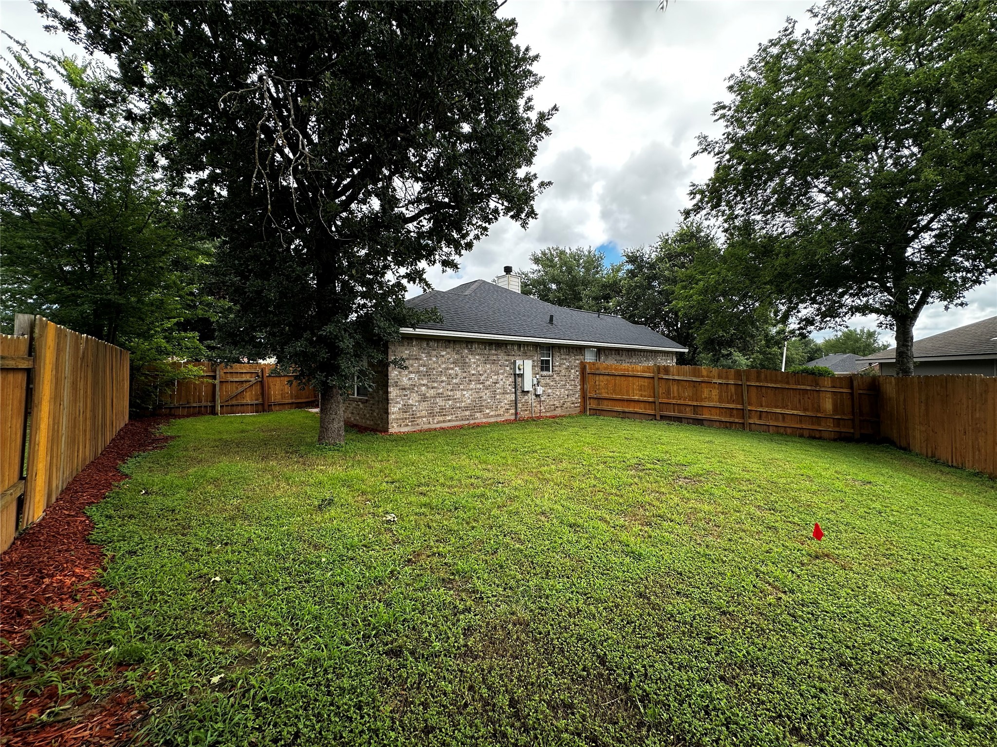 1400 Prairie Drive Bryan, TX 77802 - Photo 15 of 18 A spacious, fenced yard offers ample outdoor living space.