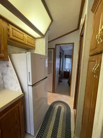 a bathroom with a granite countertop toilet sink and mirror