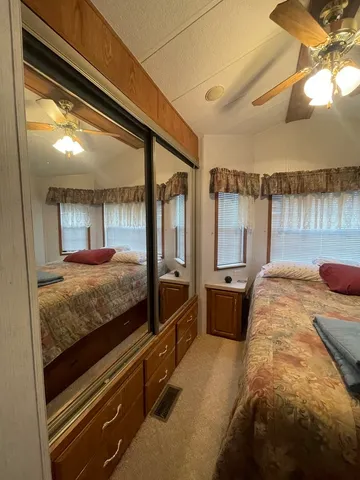 a bed room with a bed and a television