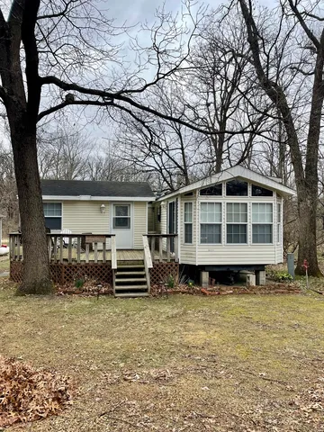 a house view with a garden space