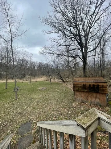 a backyard of a house with lots of green space