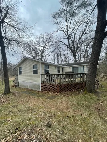 a front view of a house with sitting area