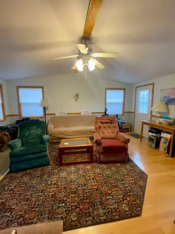 a bedroom with furniture and a window