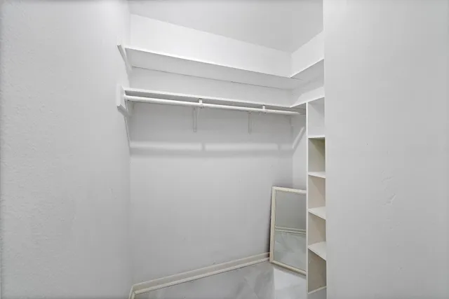 a view of an empty walk in closet