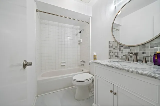a view of a hallway with washer and dryer