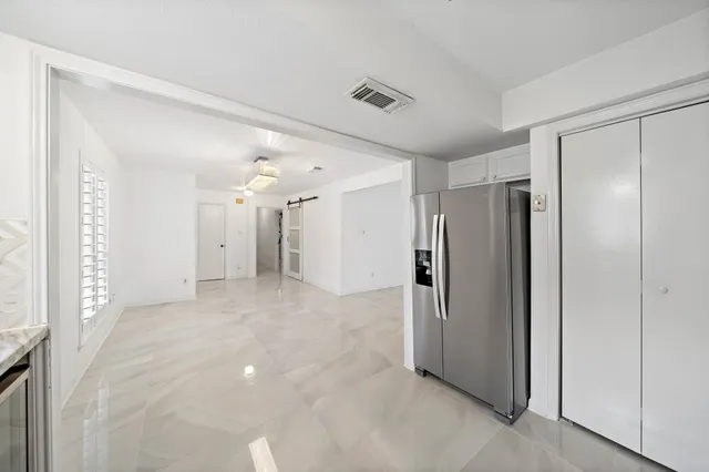 a view of a hallway with closet area