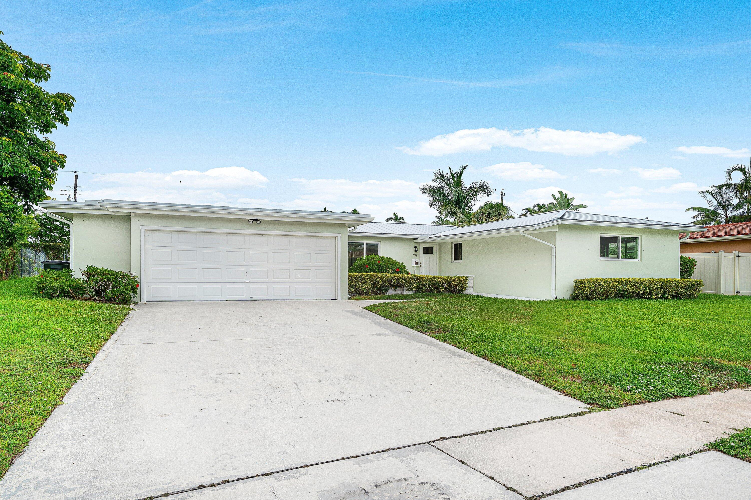 311 Northeast 23rd Way Boca Raton, FL 33431 - Photo 2 of 31 Driveway