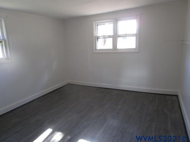 6912 Liberty Road South Salem, OR 97306 - Photo 8 of 37 an empty room with wooden floor and windows