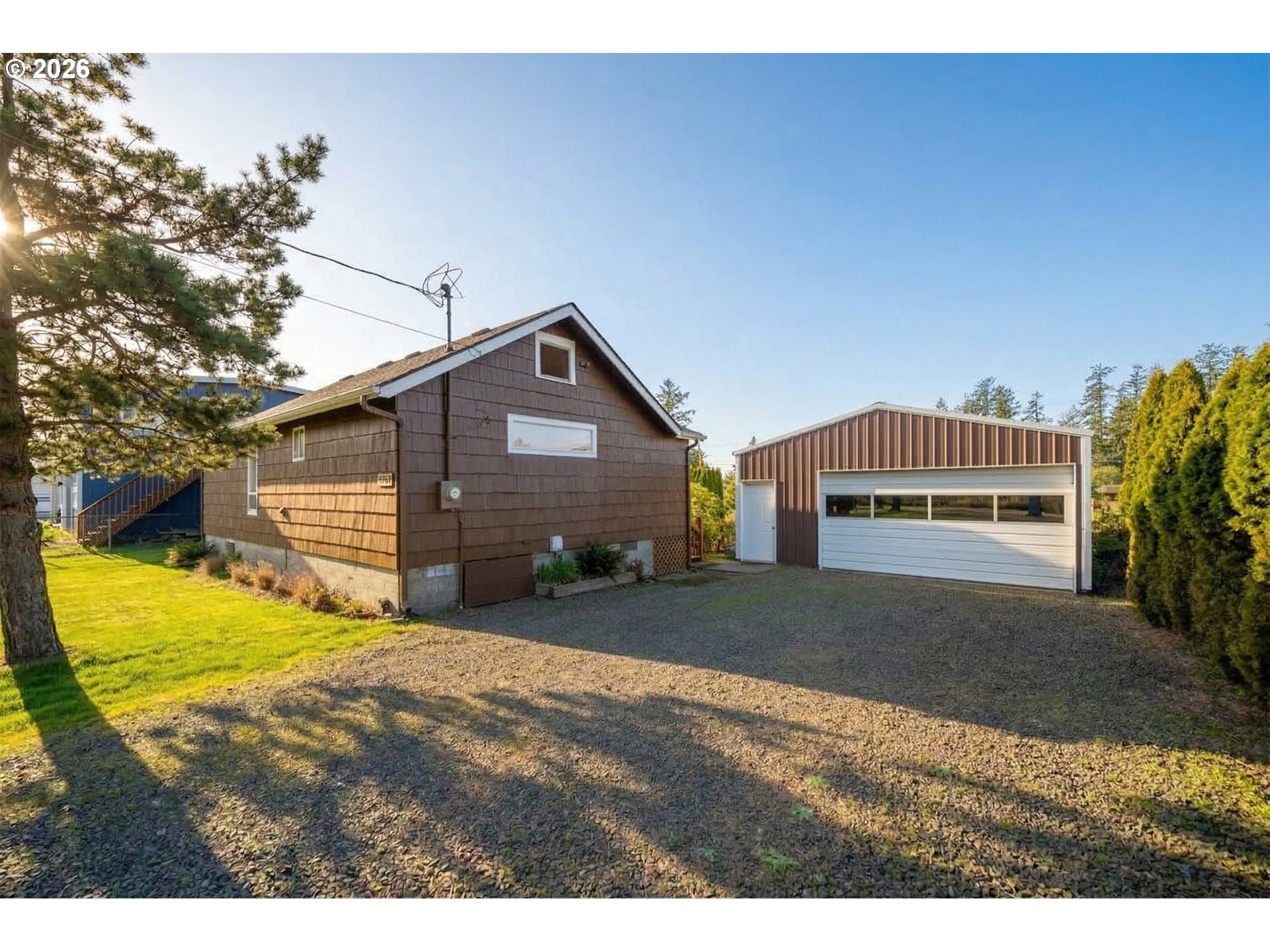 34650 2nd Street Cloverdale, OR 97112 - Photo 1 of 37 a front view of a house with a yard and garage