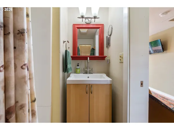 a bathroom with a sink and a mirror