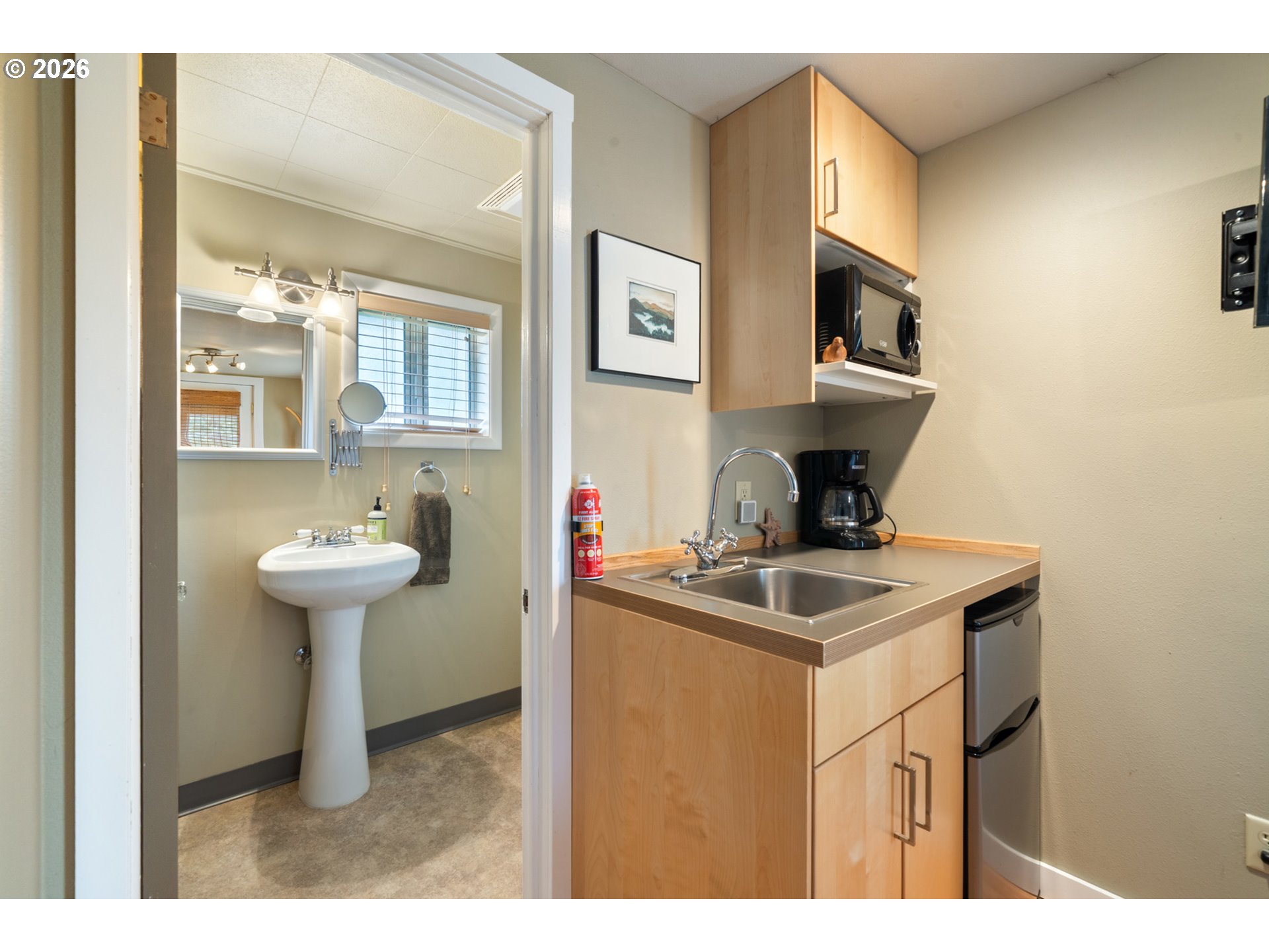 34650 2nd Street Cloverdale, OR 97112 - Photo 26 of 37 a bathroom with a sink a mirror and a toilet