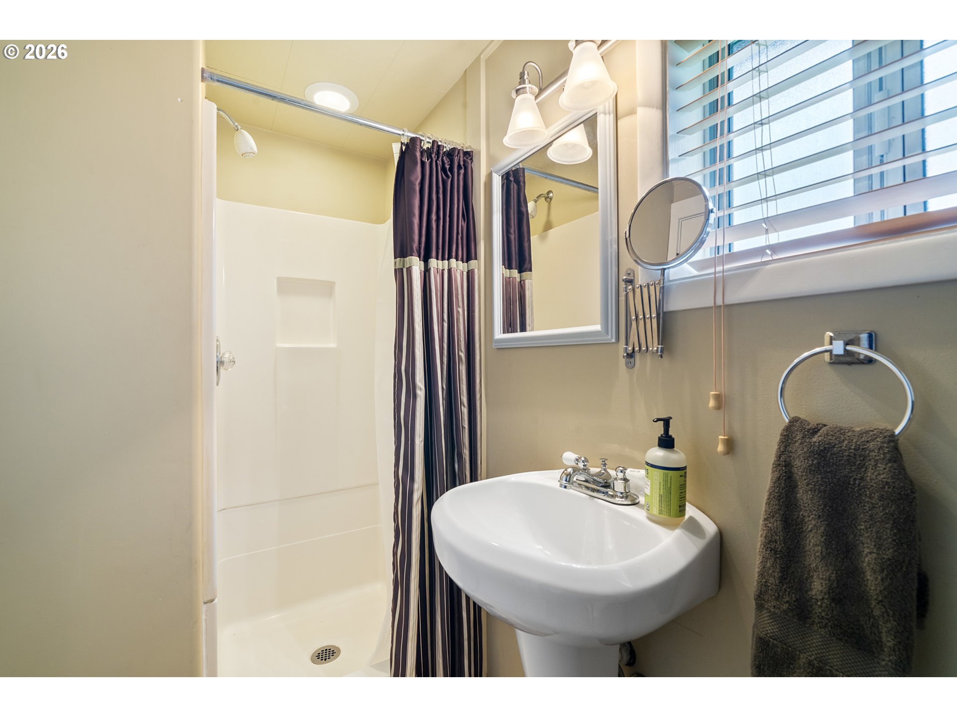 34650 2nd Street Cloverdale, OR 97112 - Photo 28 of 37 a bathroom with a sink a toilet and mirror