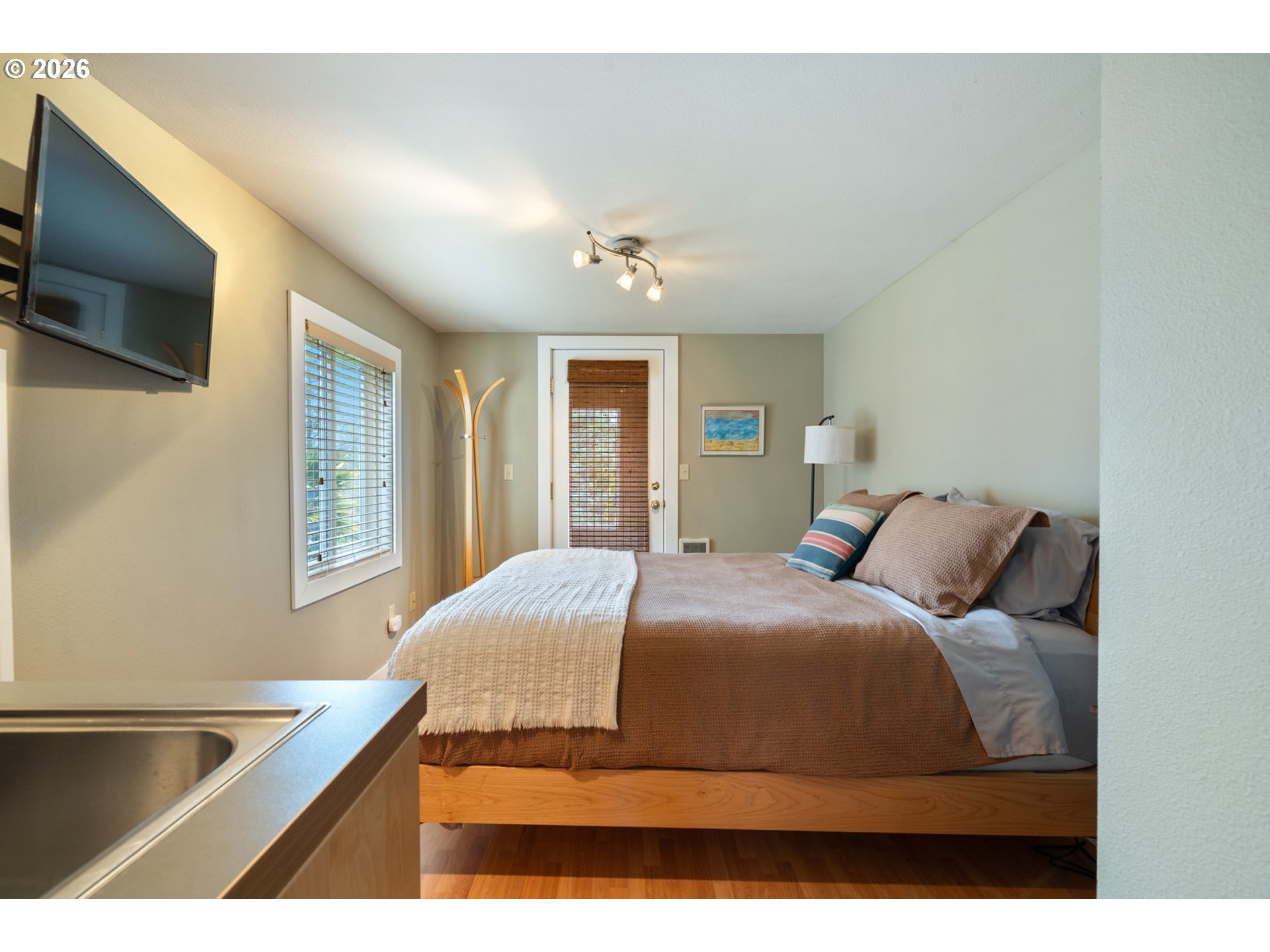 34650 2nd Street Cloverdale, OR 97112 - Photo 29 of 37 a bedroom with a bed and a flat screen tv