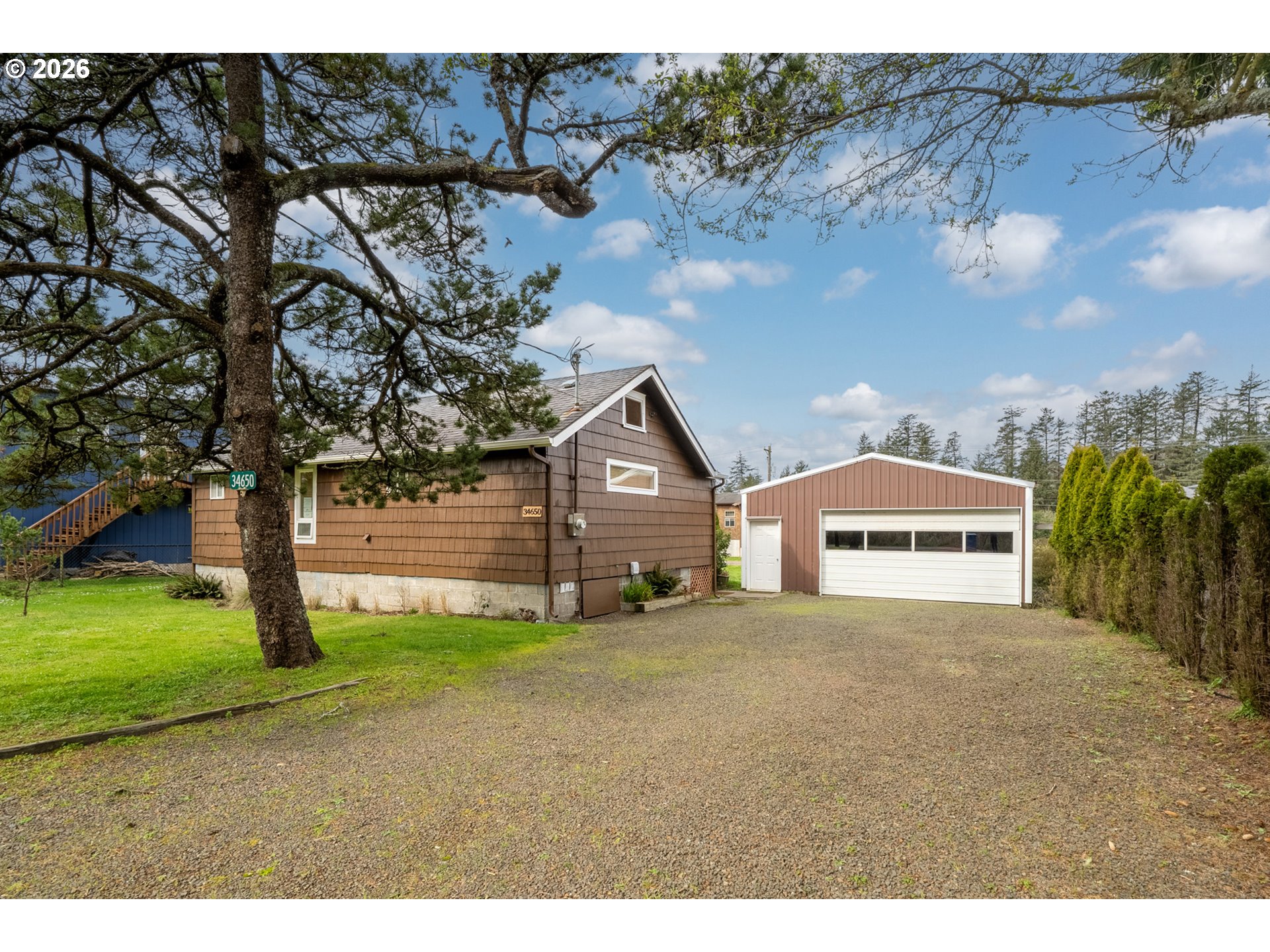 34650 2nd Street Cloverdale, OR 97112 - Photo 31 of 37 a view of a house with a yard and garage