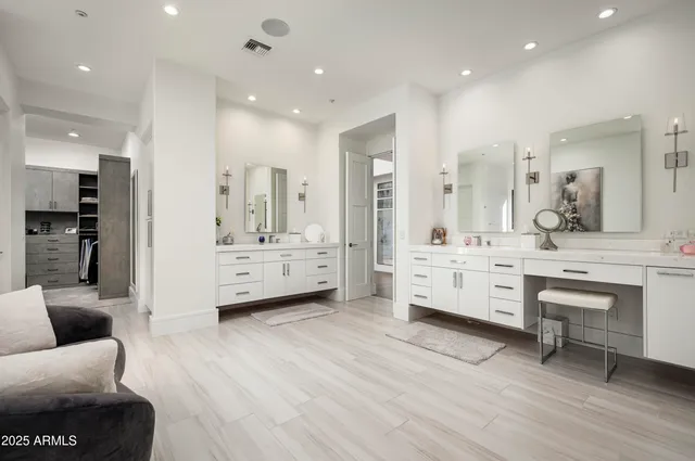 a bathroom with a double vanity sink and a mirror