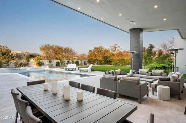 a living room with fireplace furniture and a large window