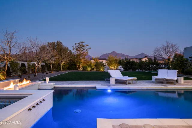 a living room with fireplace furniture and a fireplace