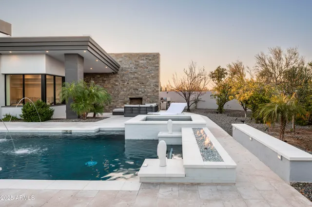 a view of house with outdoor space and swimming pool