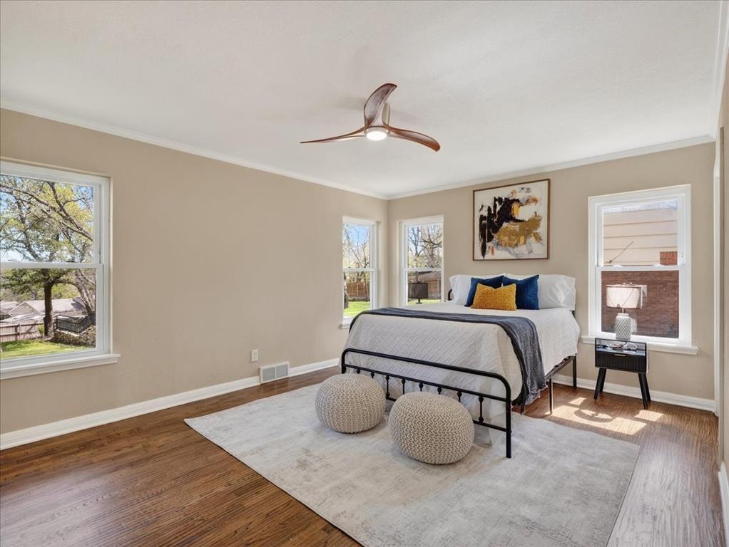 3863 Clayton Road East Fort Worth, TX 76116 - Photo 20 of 39 a bedroom with a bed and wooden floor