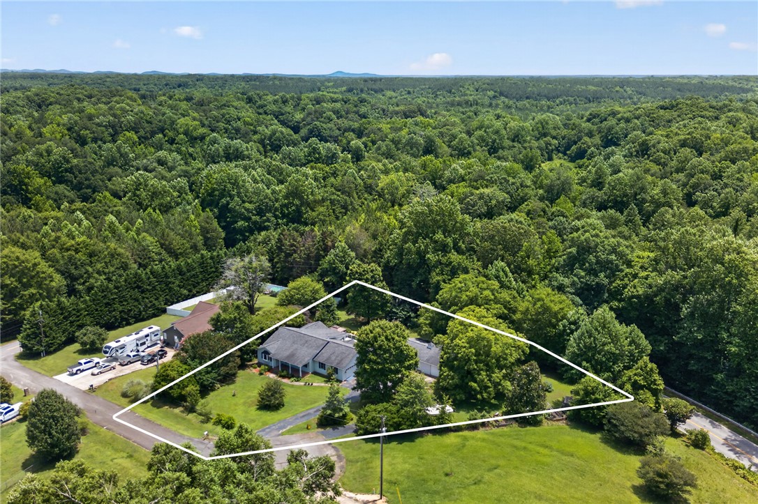 103 Dorsey Lane Walhalla, SC 29691 - Photo 38 of 42 An aerial perspective showcases a private estate surrounded by lush, mature trees and ample green spaces.