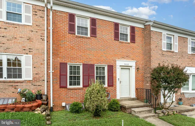 a front view of a house with yard