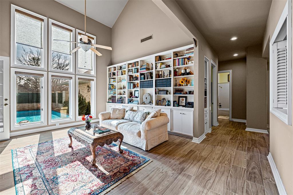 8908 Brierfield Road Granbury, TX 76049 - Photo 10 of 40 a living room with furniture and a floor to ceiling window