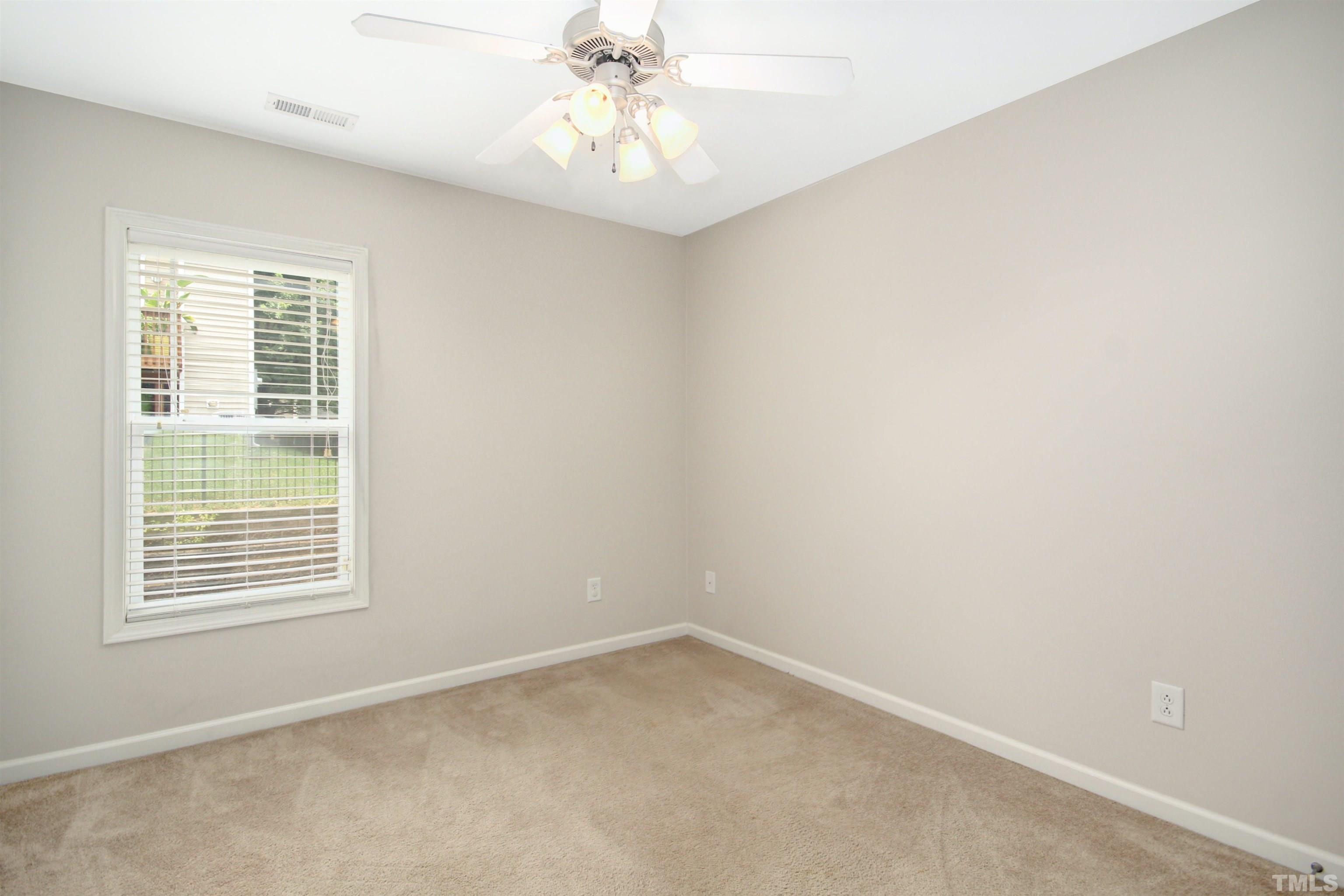 4611 Altha Street Raleigh, NC 27606 - Photo 13 of 19 an empty room with a window