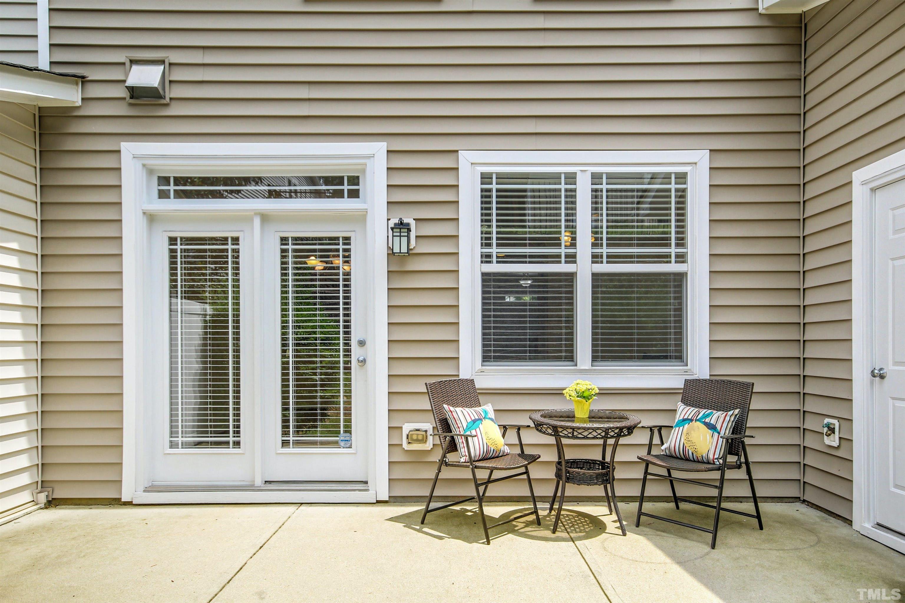 4611 Altha Street Raleigh, NC 27606 - Photo 17 of 19 a view of a brick house with table and chairs