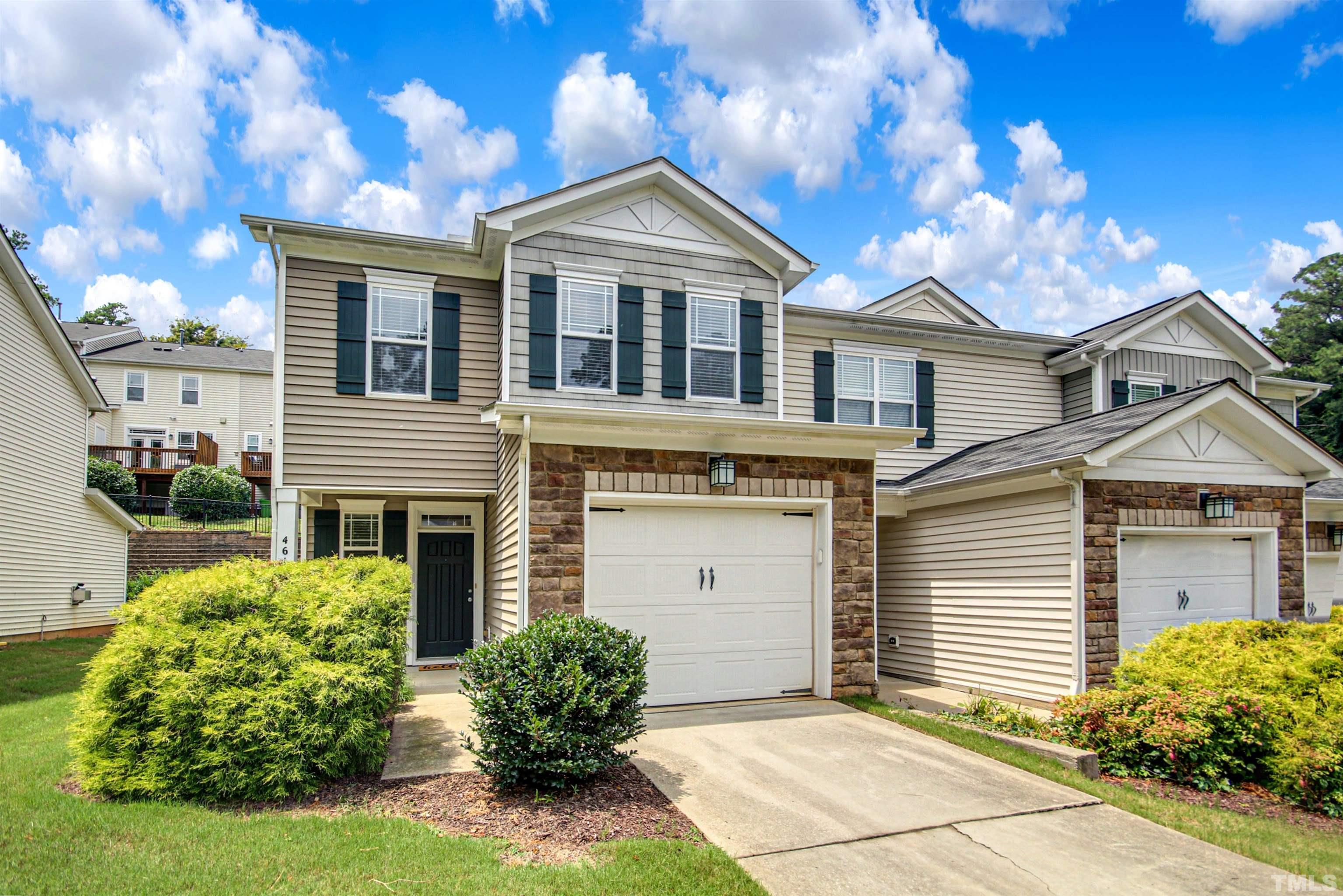 4611 Altha Street Raleigh, NC 27606 - Photo 2 of 19 a front view of a house with garden