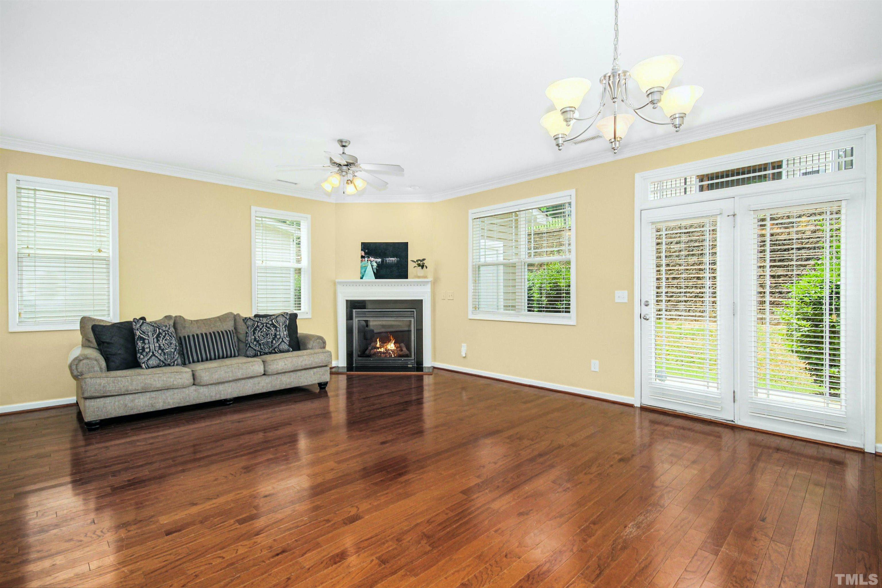 4611 Altha Street Raleigh, NC 27606 - Photo 3 of 19 a living room with furniture and a fireplace