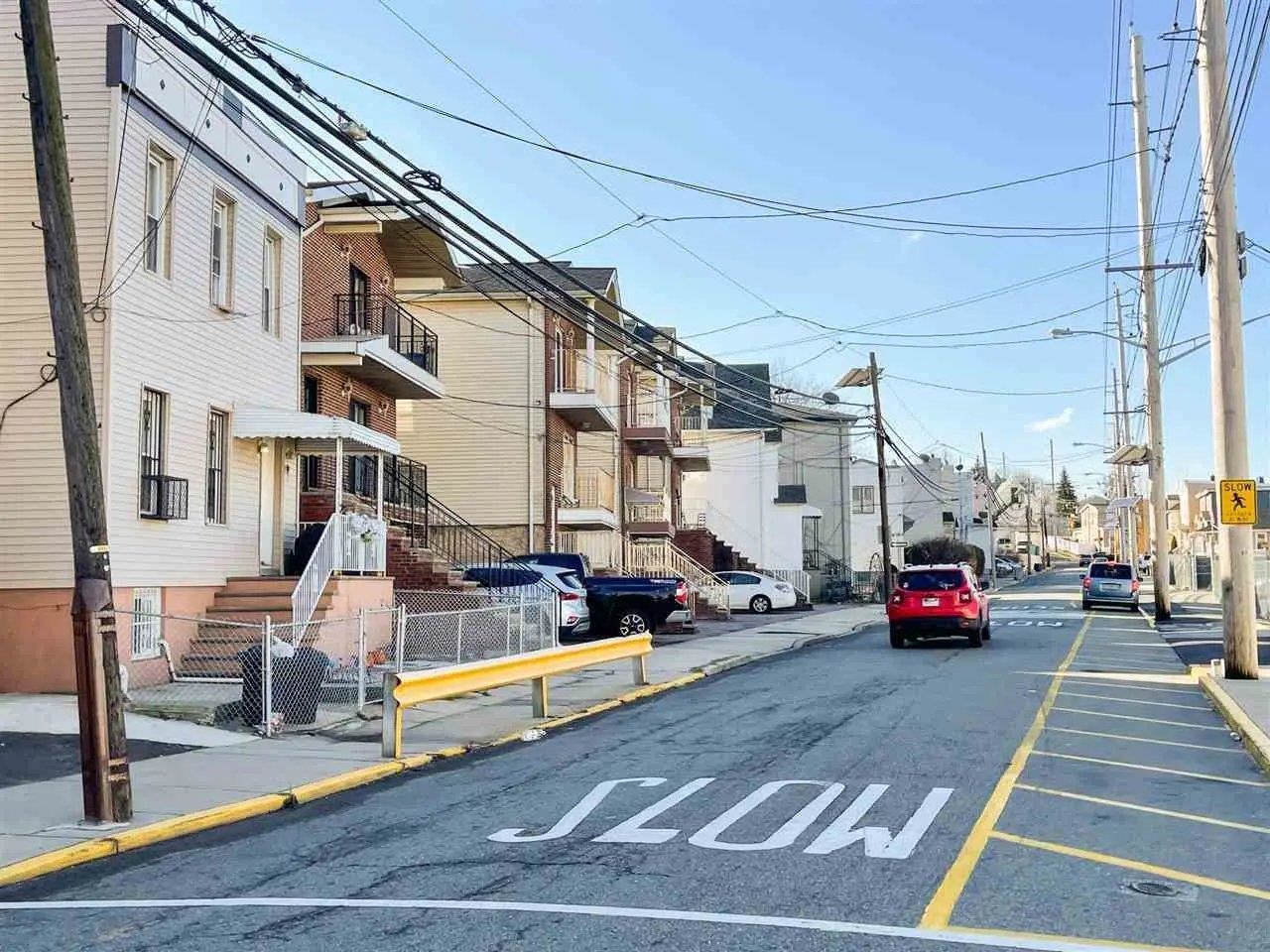 3900 Liberty Avenue, Unit 1B North Bergen, NJ 07047 - Photo 14 of 15 a cars parked on the side of a street
