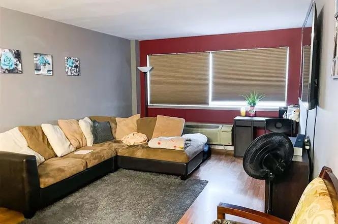 3900 Liberty Avenue, Unit 1B North Bergen, NJ 07047 - Photo 8 of 15 a living room with furniture and a large window