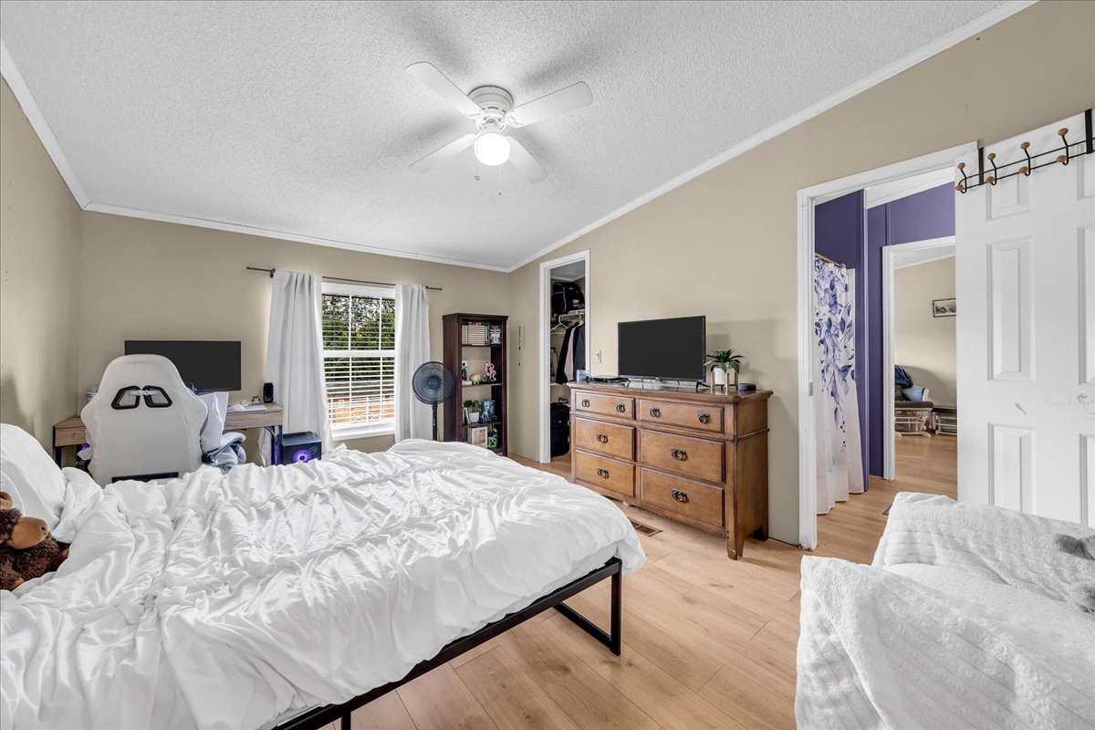 2657 Oak Grove Road Red Boiling Springs, TN 37150 - Photo 30 of 45 a bedroom with a bed and a flat screen tv