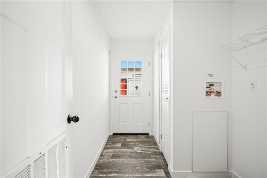 6 Berry Farms Road, Unit 63 Sturbridge, MA 01566 - Photo 17 of 17 a view of a hallway with wooden floor and entryway