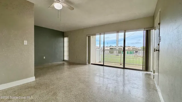 a view of an empty room with a window