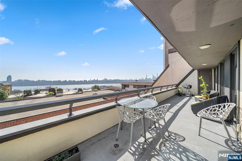300 Gorge Road, Unit 58 Cliffside Park, NJ 07010 - Photo 12 of 32 a view of a terrace with seating area