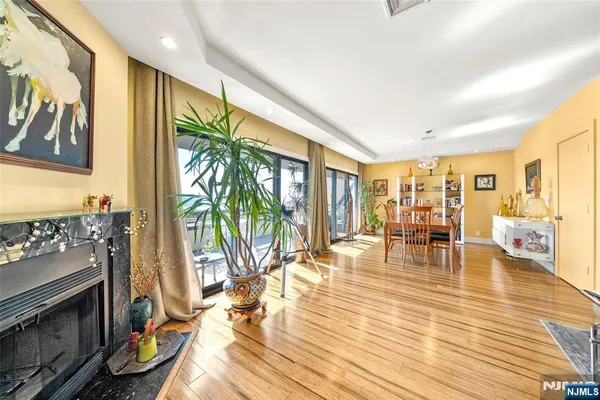 a living room with furniture and large windows
