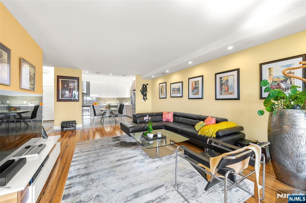 300 Gorge Road, Unit 58 Cliffside Park, NJ 07010 - Photo 17 of 32 a living room with furniture and wooden floor