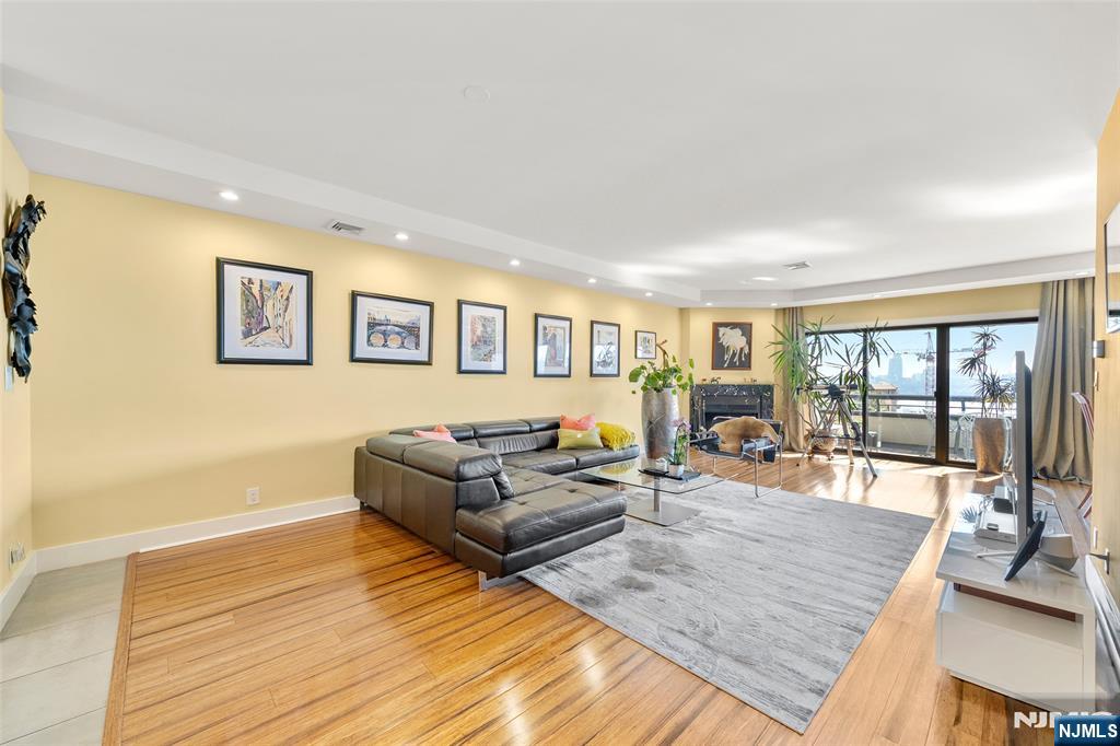 300 Gorge Road, Unit 58 Cliffside Park, NJ 07010 - Photo 18 of 32 a living room with furniture and large windows