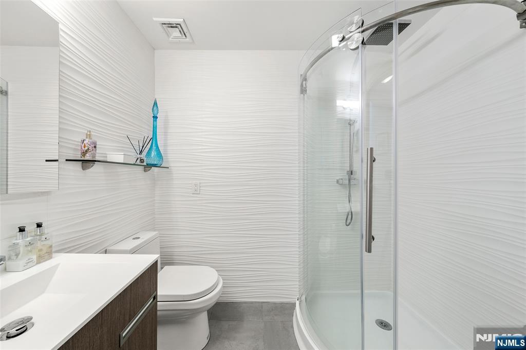 300 Gorge Road, Unit 58 Cliffside Park, NJ 07010 - Photo 24 of 32 a bathroom with a sink toilet and shower