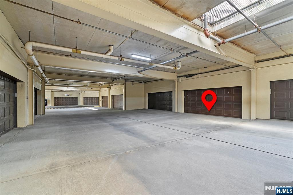 300 Gorge Road, Unit 58 Cliffside Park, NJ 07010 - Photo 27 of 32 a view of an empty room with a garage