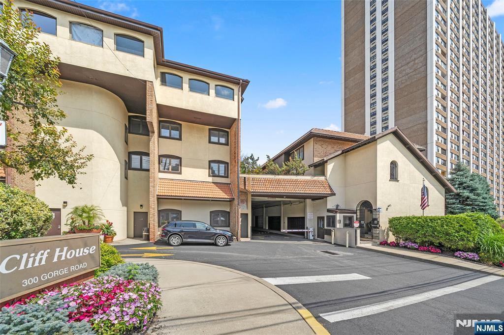300 Gorge Road, Unit 58 Cliffside Park, NJ 07010 - Photo 4 of 32 a front view of a building with parking