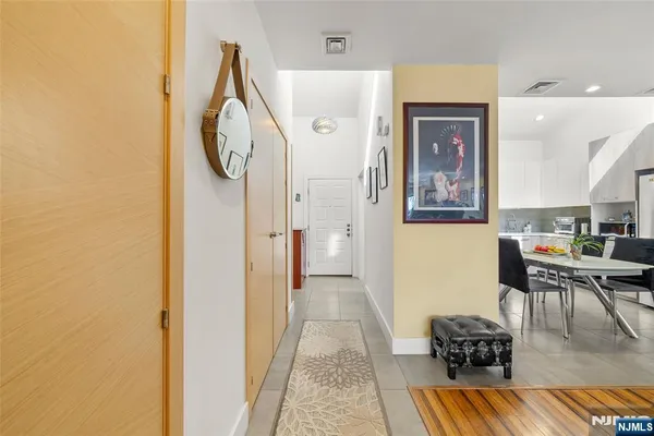 a large kitchen with a table and chairs