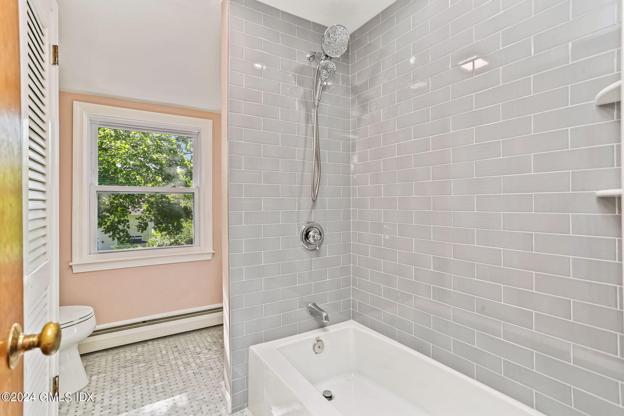 38 Maplewood Drive Cos Cob, CT 06807 - Photo 13 of 24 a bathroom with a bathtub and a shower