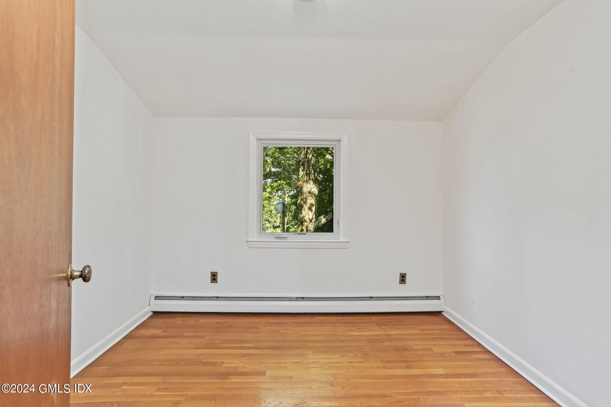 38 Maplewood Drive Cos Cob, CT 06807 - Photo 17 of 24 a view of a small space with wooden floor and a window