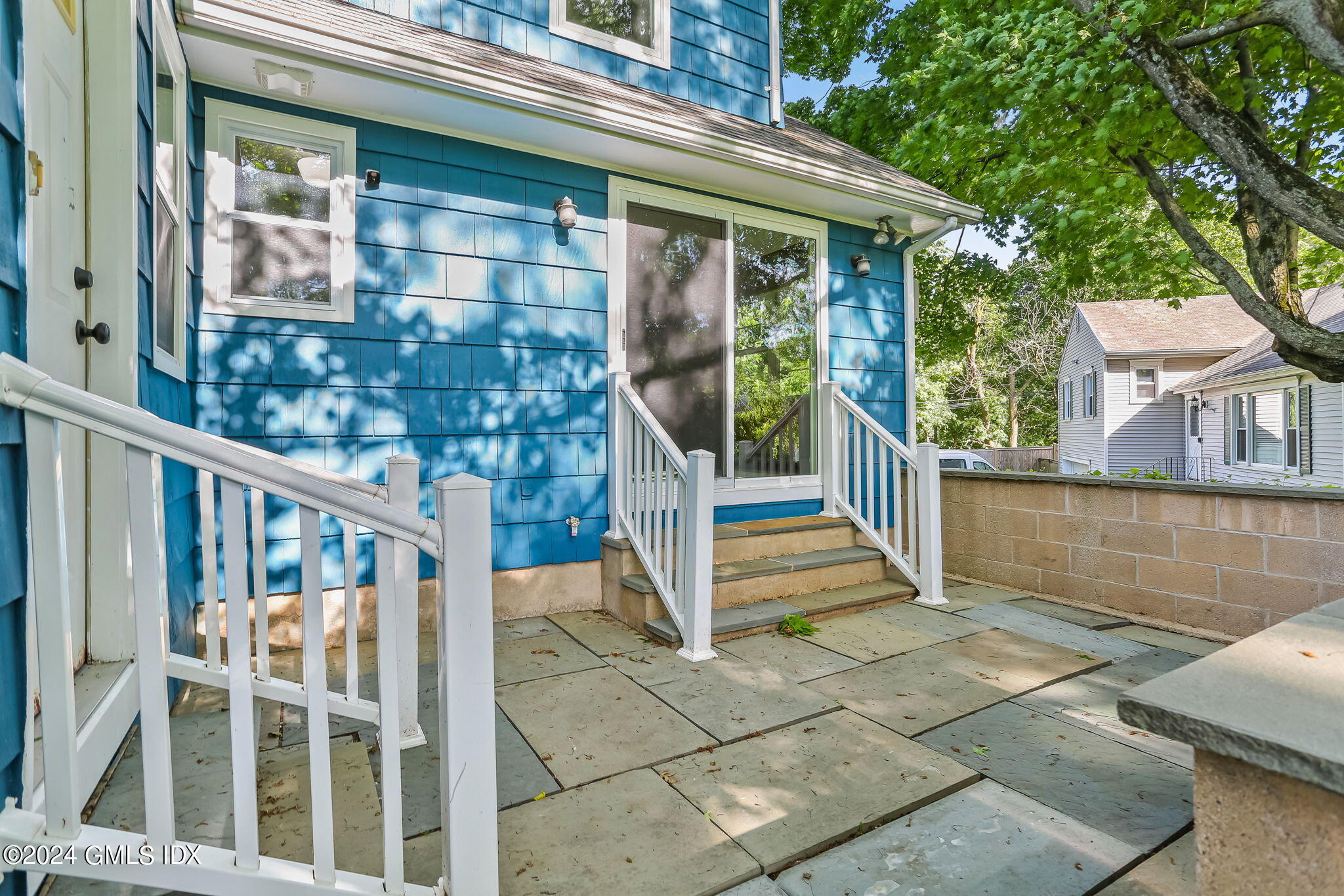 38 Maplewood Drive Cos Cob, CT 06807 - Photo 20 of 24 a view of a house with entryway and wooden fence