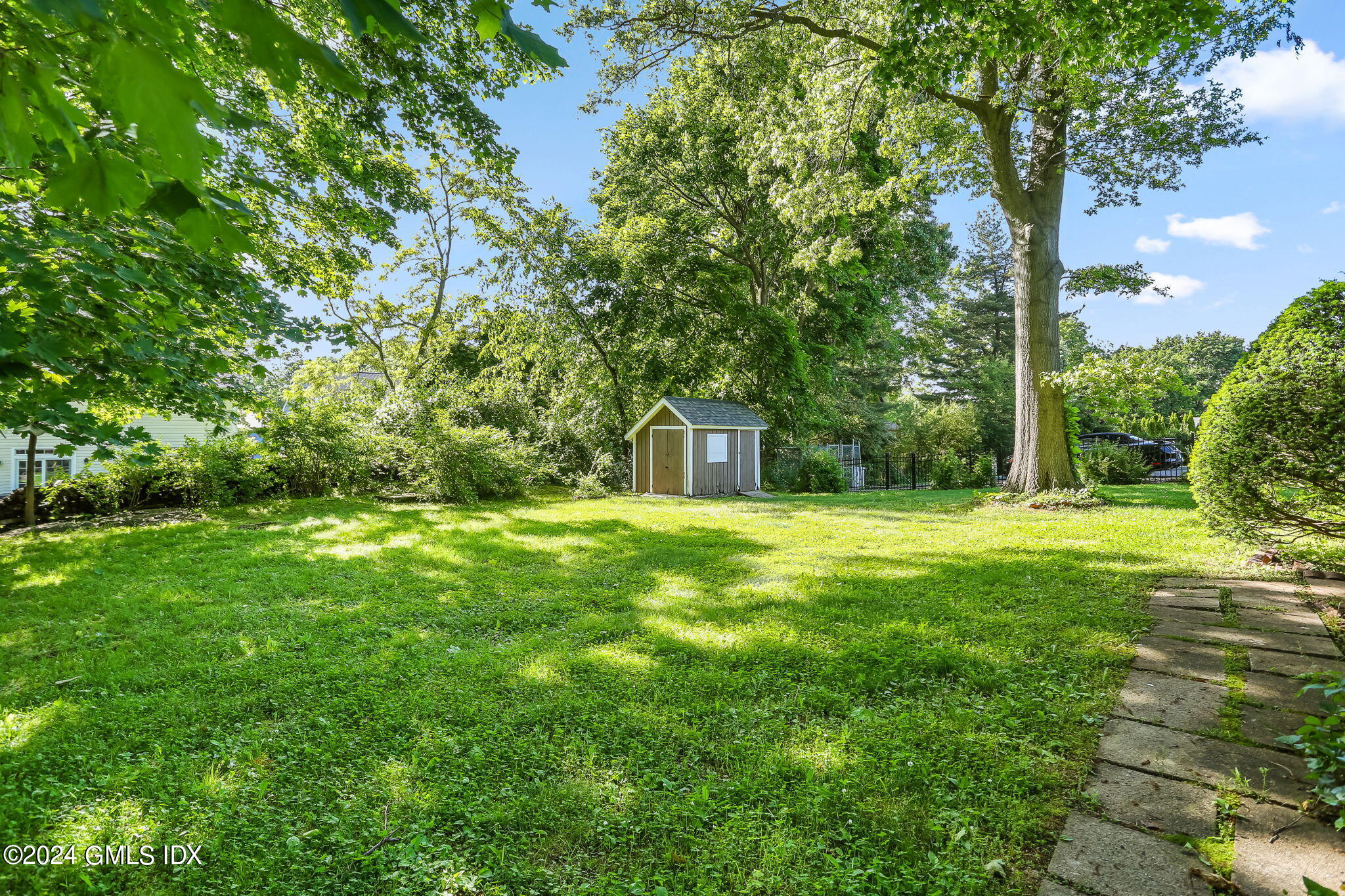38 Maplewood Drive Cos Cob, CT 06807 - Photo 21 of 24 a front view of a house with a yard