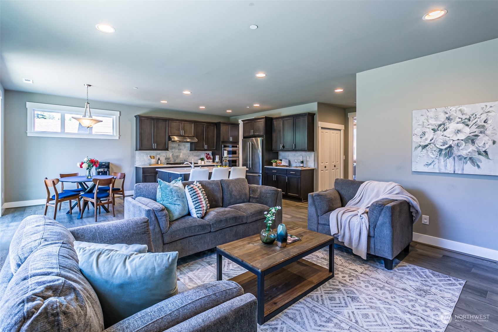 4918 Northeast 1st Street Renton, WA 98059 - Photo 13 of 40 a living room with furniture and kitchen view