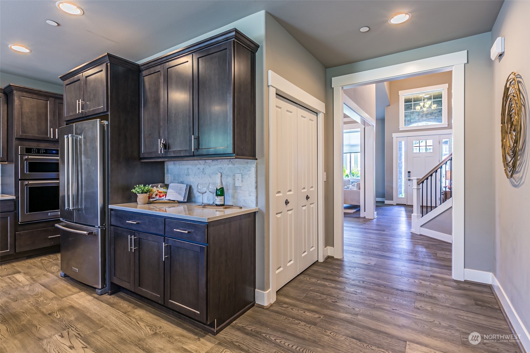 4918 Northeast 1st Street Renton, WA 98059 - Photo 15 of 40 a kitchen with stainless steel appliances granite countertop a refrigerator and a sink