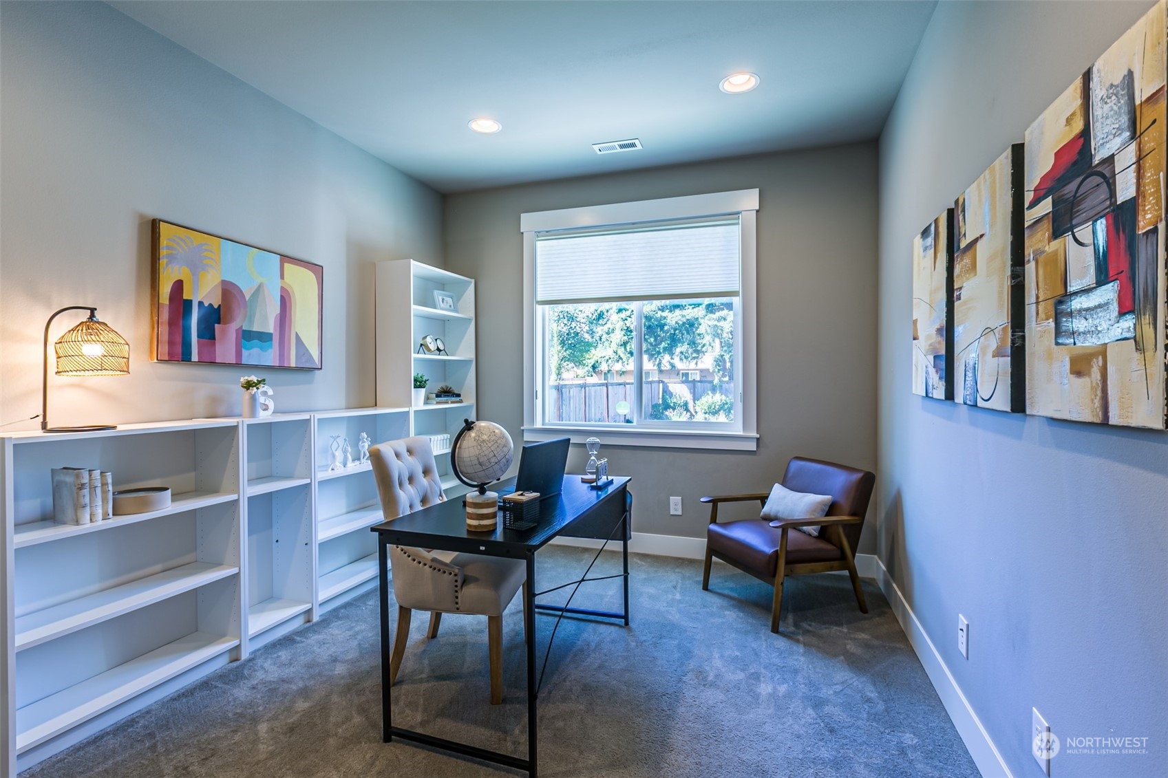 4918 Northeast 1st Street Renton, WA 98059 - Photo 23 of 40 a work room with furniture and a bookshelf